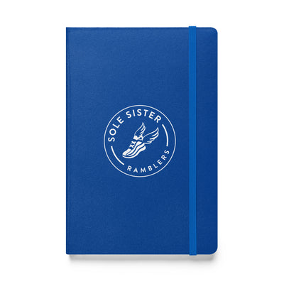 Royal blue notebook with round Sole Sister Ramblers logo.
