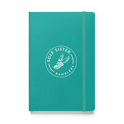 Royal teal notebook with round Sole Sister Ramblers logo.