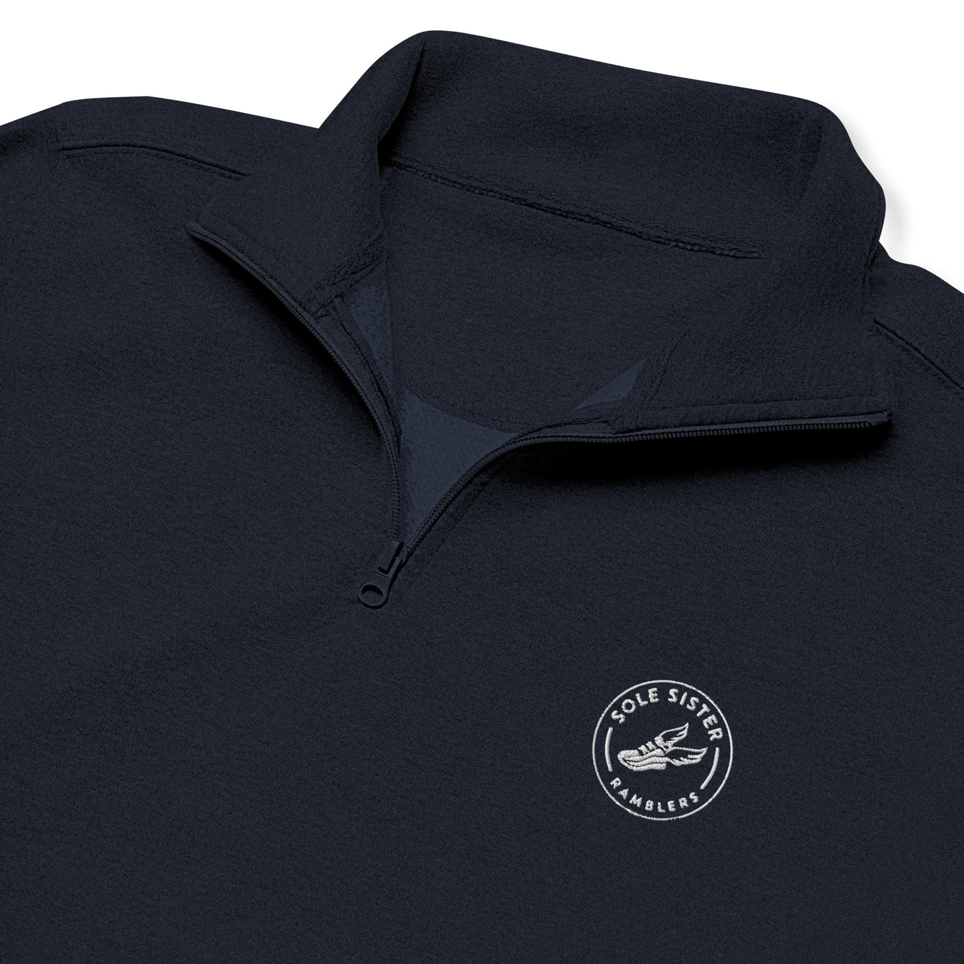 Front view close up of the top of black fleece with 3/4 zip and round Sole Sister Ramblers logo.