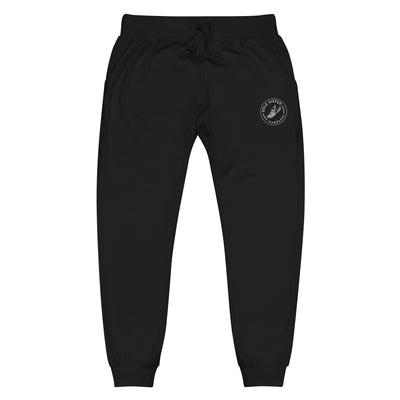 Front view of top of black sweatpants with round Sole Sister Ramblers logo on top leg.