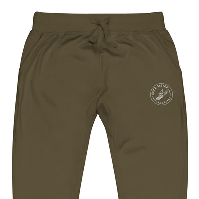 Front view of top of olive green sweatpants with round Sole Sister Ramblers logo on top leg.