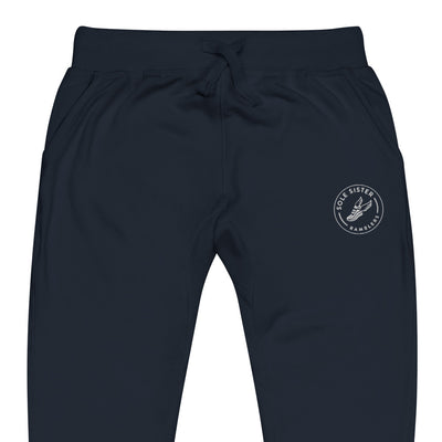 Front view of top of navy sweatpants with round Sole Sister Ramblers logo on top leg.
